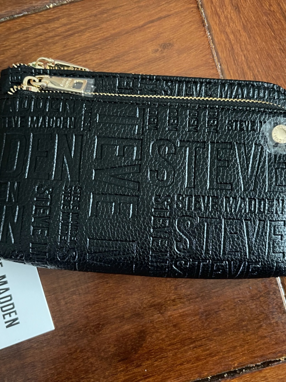 Steve Madden Black Embossed Logo Zip Wristlet with Gold Hardware